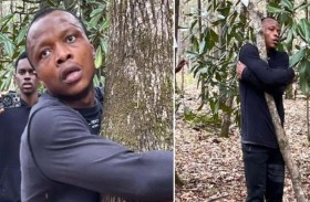 رجل يعانق ألف شجرة لتسجيل رقم قياسي